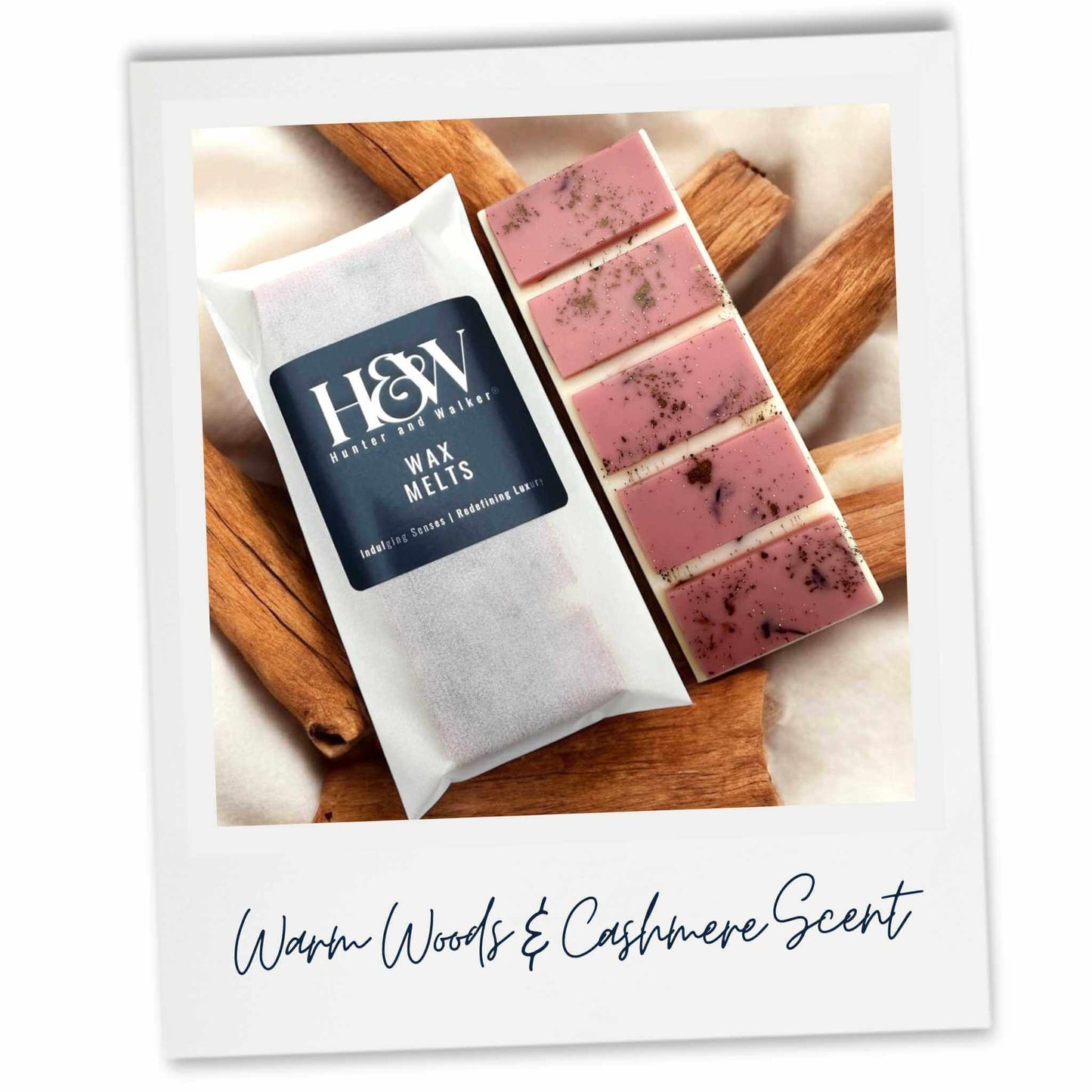 H&W wax melts packaged laying on wood surrounded by cream material