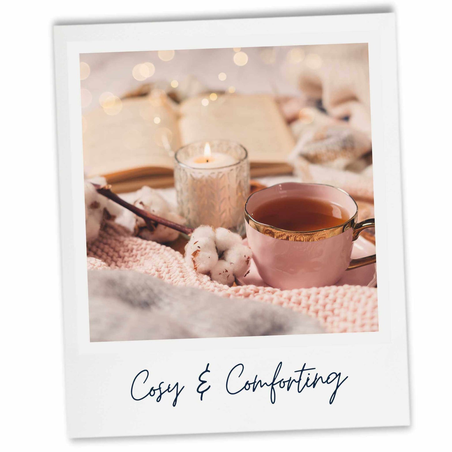 Cosy scene with a cup of tea, candle, and books on a blanket with 'Cosy & Comforting' text.