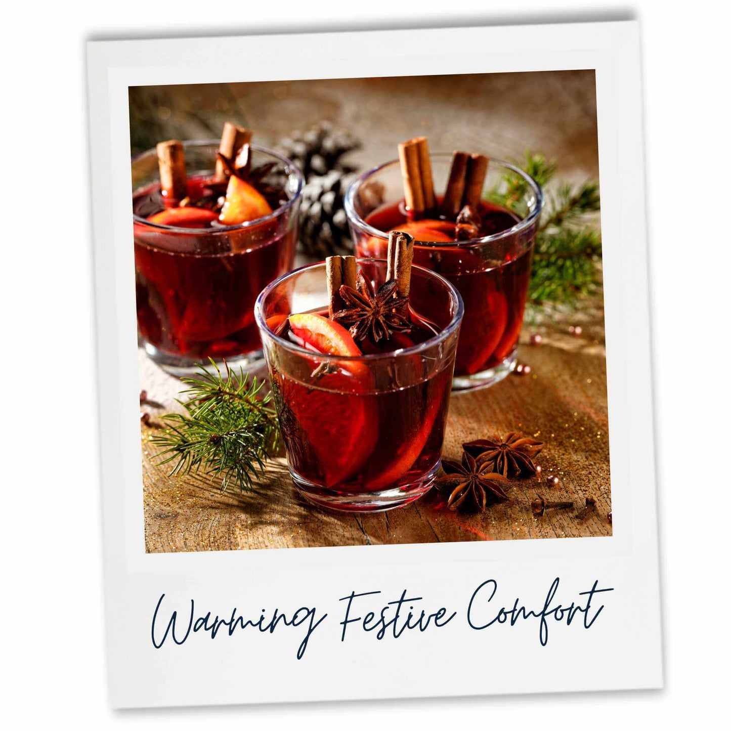 Three glasses of mulled wine with cinnamon sticks and apples on a wooden surface, labeled 'Warming Festive Comfort'.