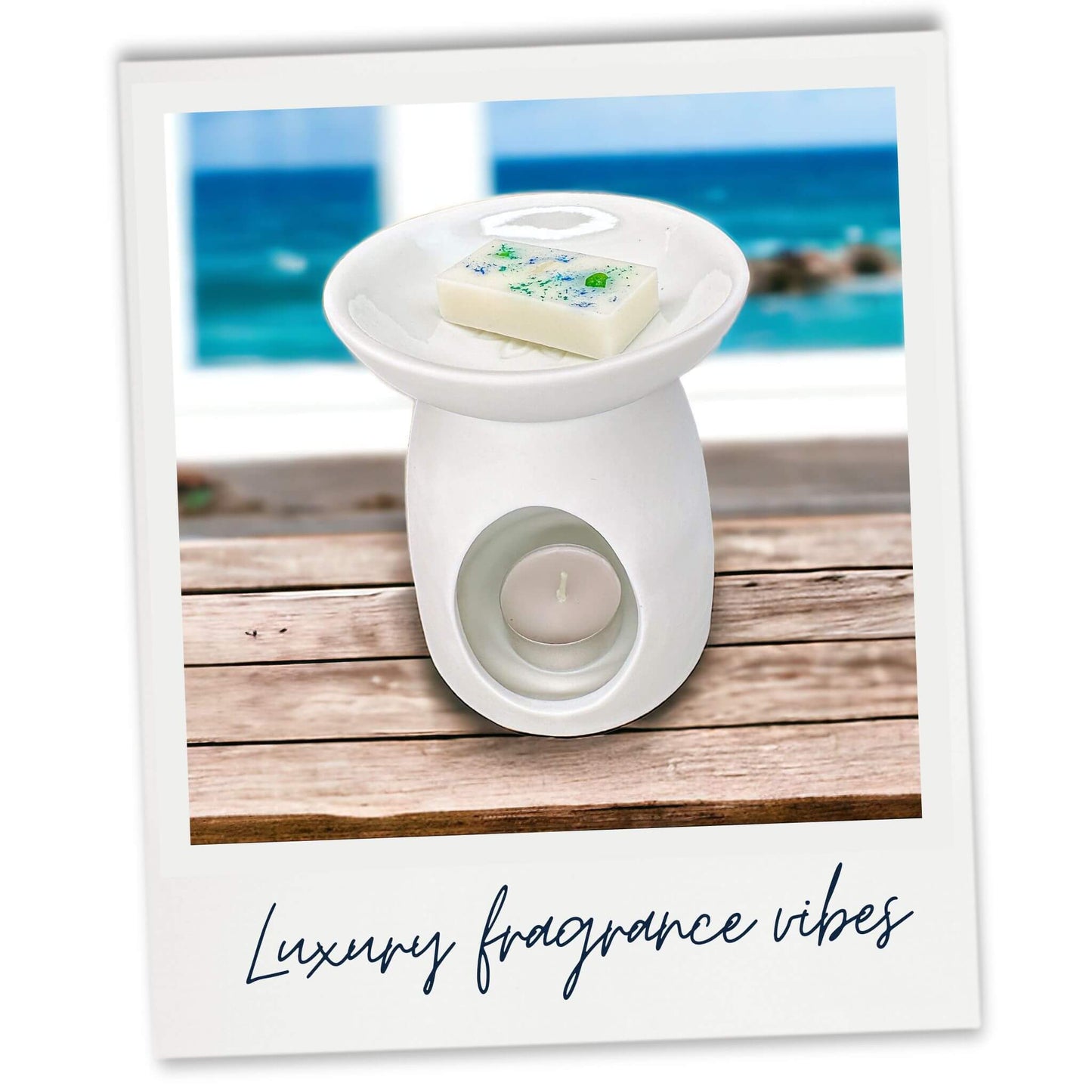 Ozone and Seafoam luxury wax melt in a white wax warmer with a seaside window view