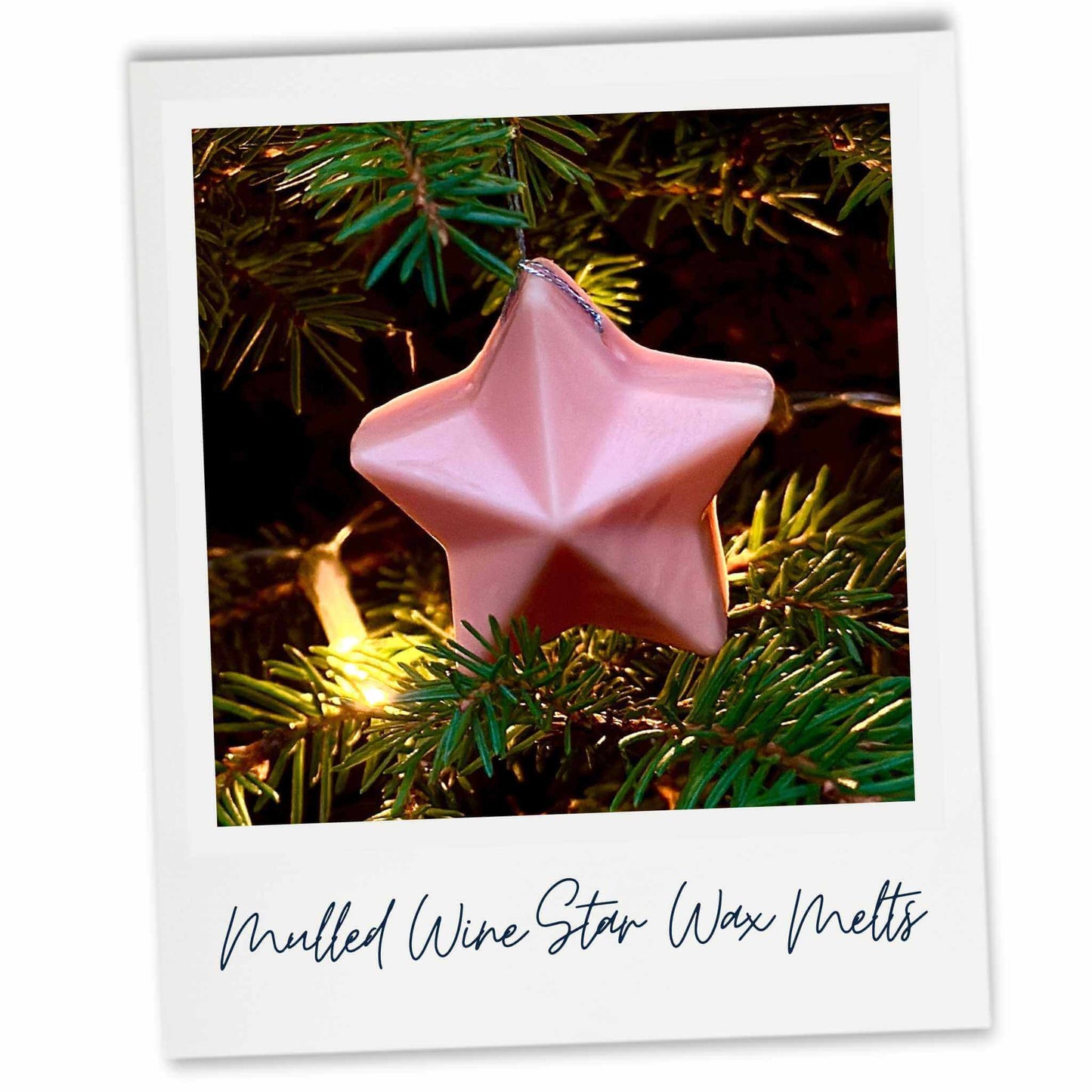 Peach coloured star-shaped wax melt on a Christmas tree