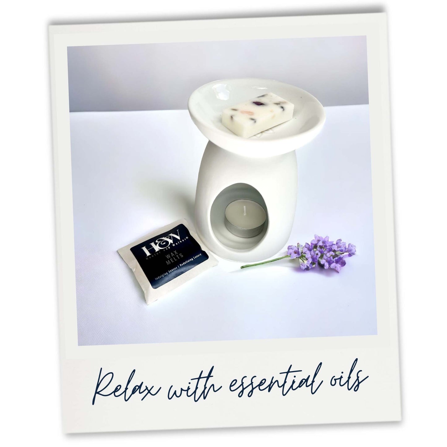 Anxiety Cleanse essential oil wax melt sample in a white wax warmer next to lavender