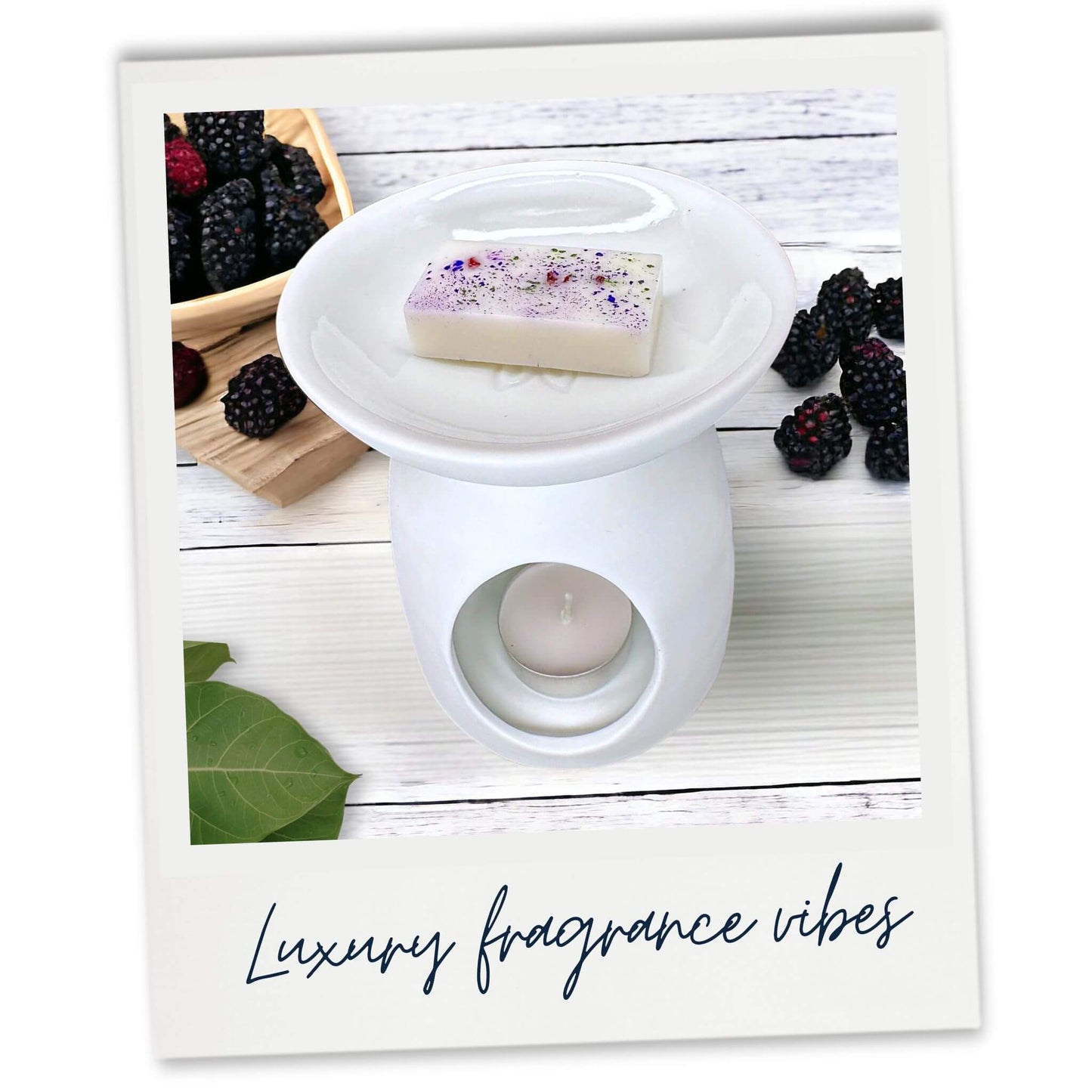 Blackberry and Bay Luxury Wax Melt sample in white wax warmer. Lifestyle image