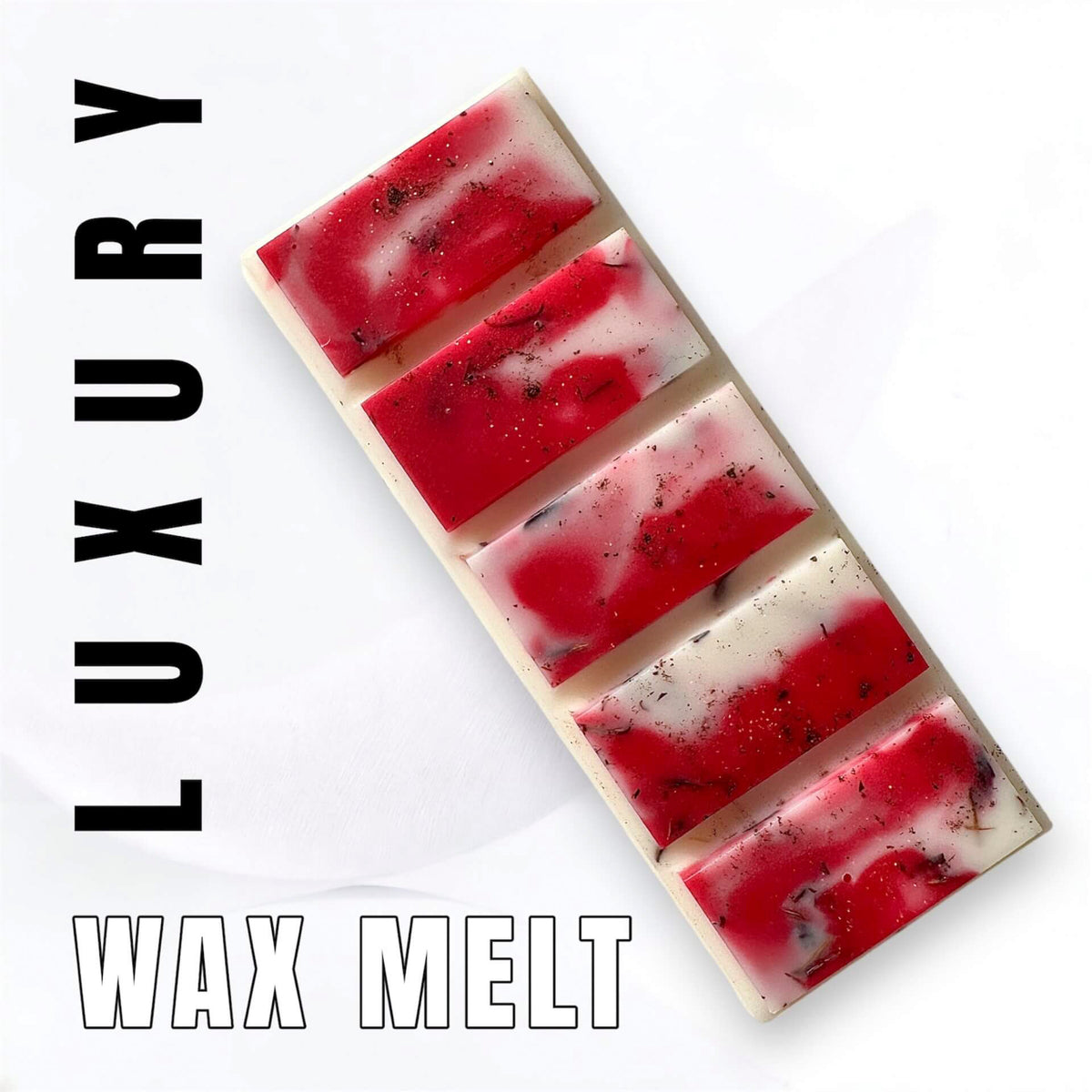 Cherry and Bitter Almond wax melts in a  pinky red and white marbled design with dark spice and cornflower botanicals on a white background with vertical 'LUXURY' text on the left and 'WAX MELT' text at the bottom.