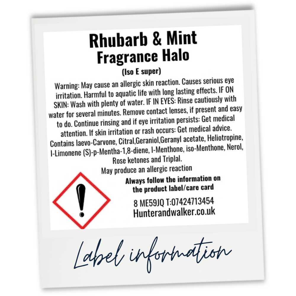 A white rectangular CLP product label card for 'Rhubarb & Mint Fragrance Halo' with black text, a red warning symbol, and handwritten blue text reading 'Label information' below, shown on a white background.