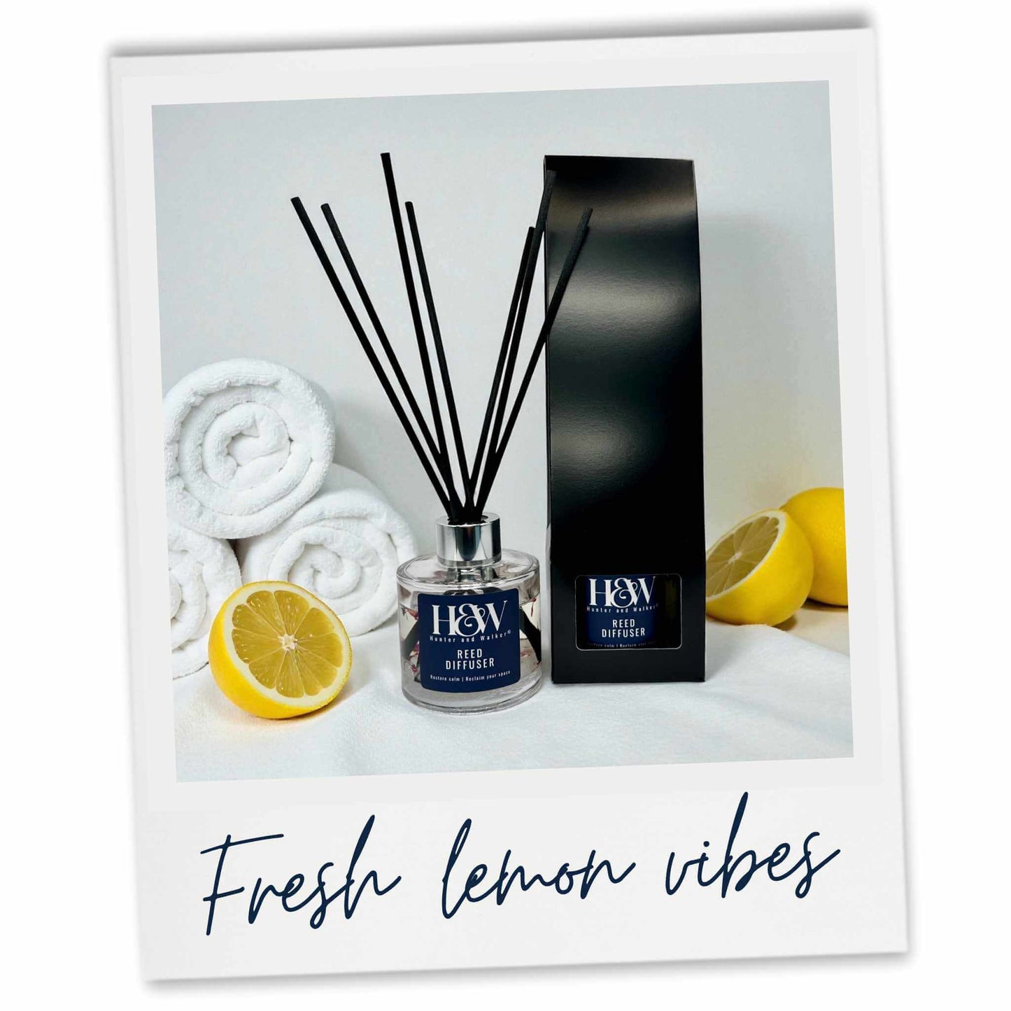 Diffuser set with lemons and towels on a light background