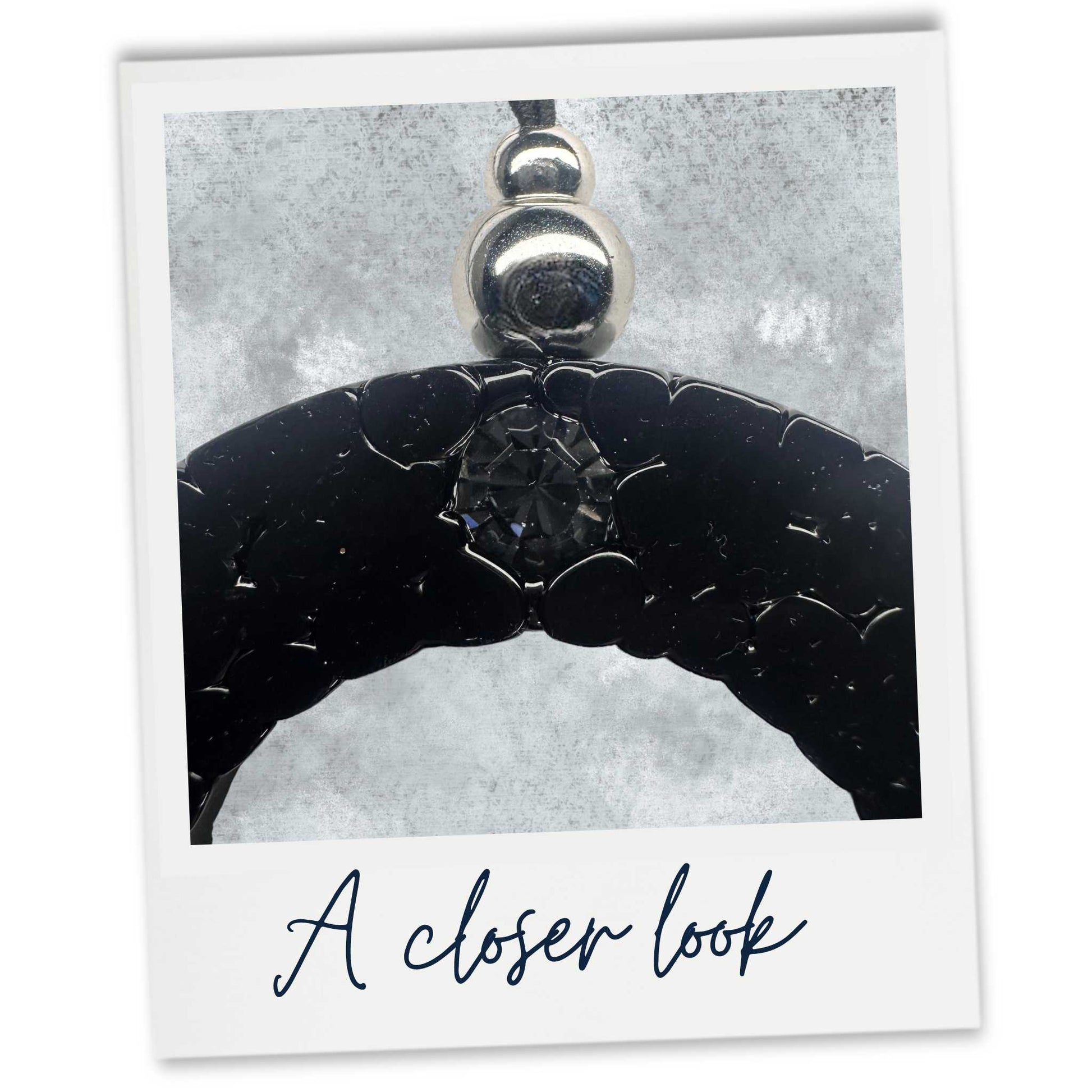 A close up look at our Lemongrass car freshener with Black Czech crystal and silver coloured beading