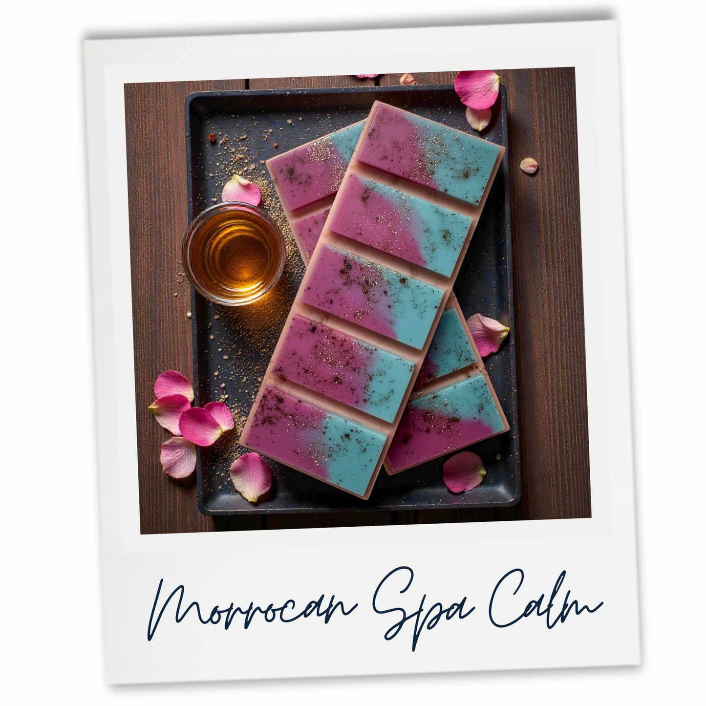 Colorful waxbars on a dark tray with rose petals and a glass of water, labeled 'Moroccan Spa Calm'.