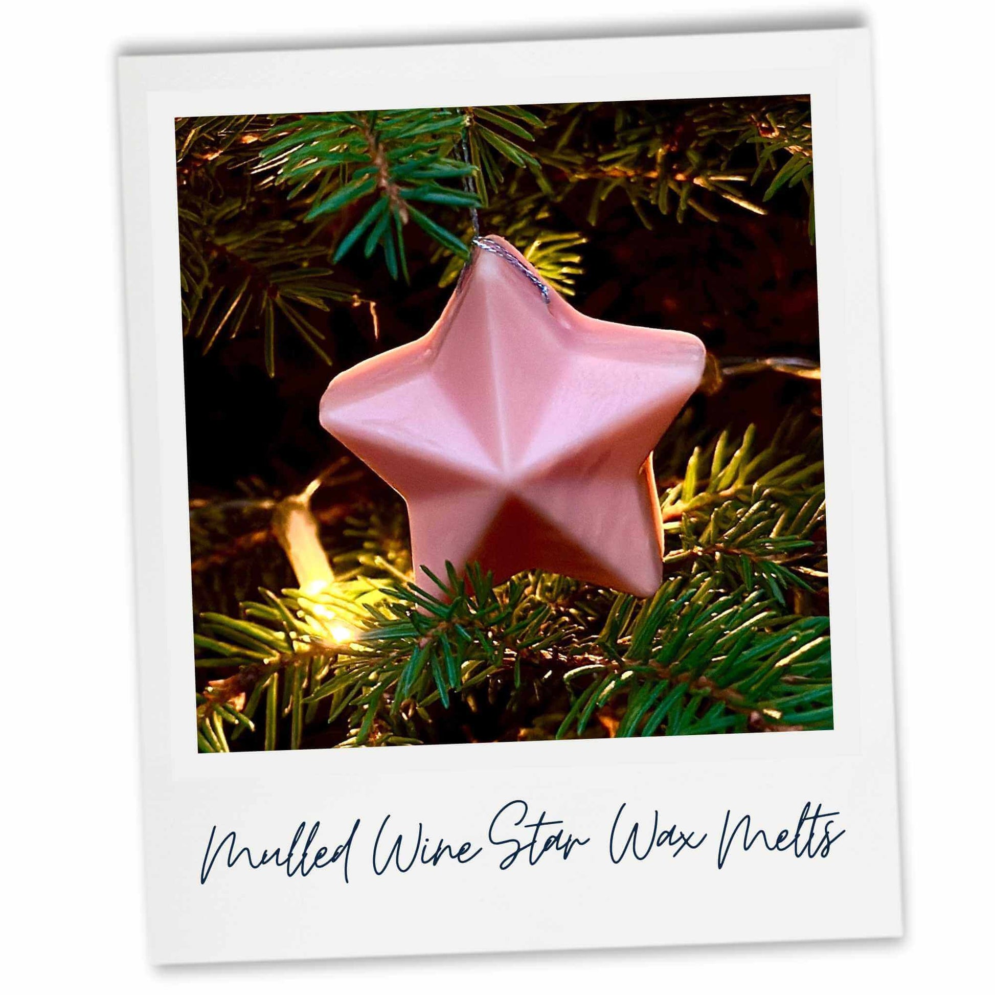 Peach coloured star-shaped wax melt on a Christmas tree