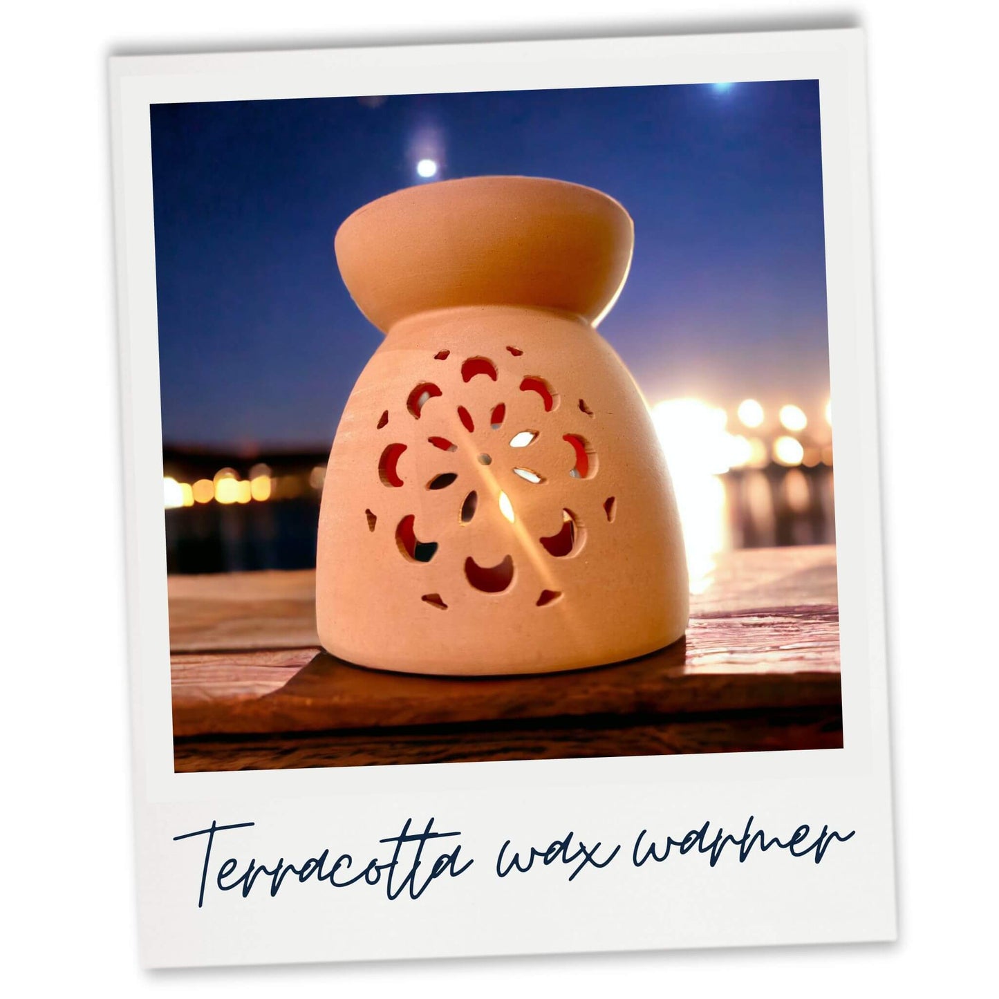 Terracotta Garden Wax Warmer. Rear view on a balcony