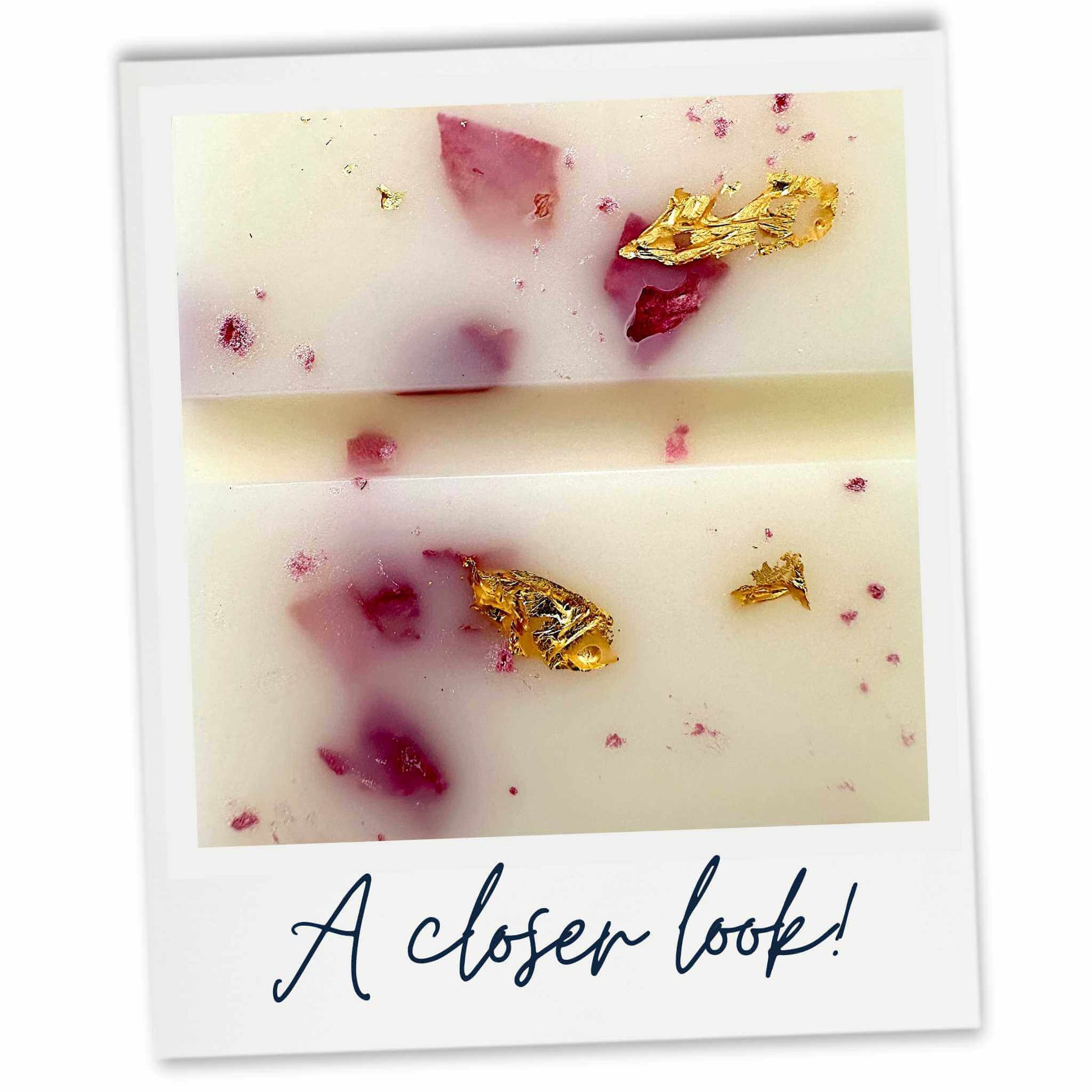 Close-up of a Velvet Santal wax melt with gold leaf and pink petals, labelled 'A closer look!'.