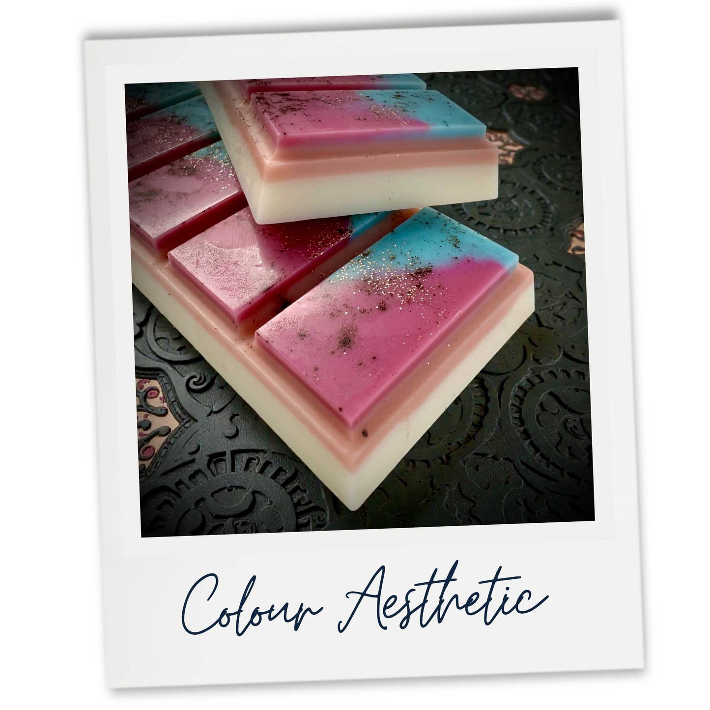 Colorful wax melt snap bars on a textured black surface with 'Colour Aesthetic' text.