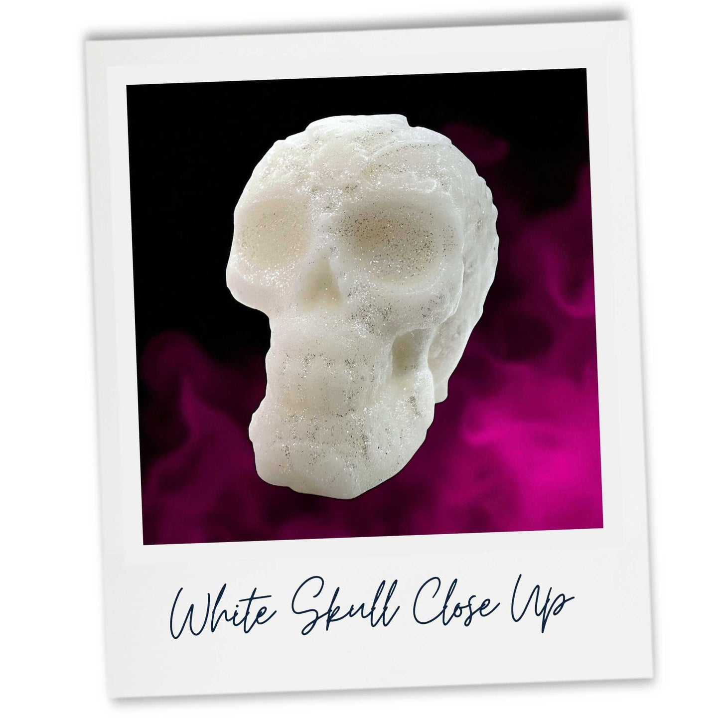Close up of a white wax skull on dark pink background